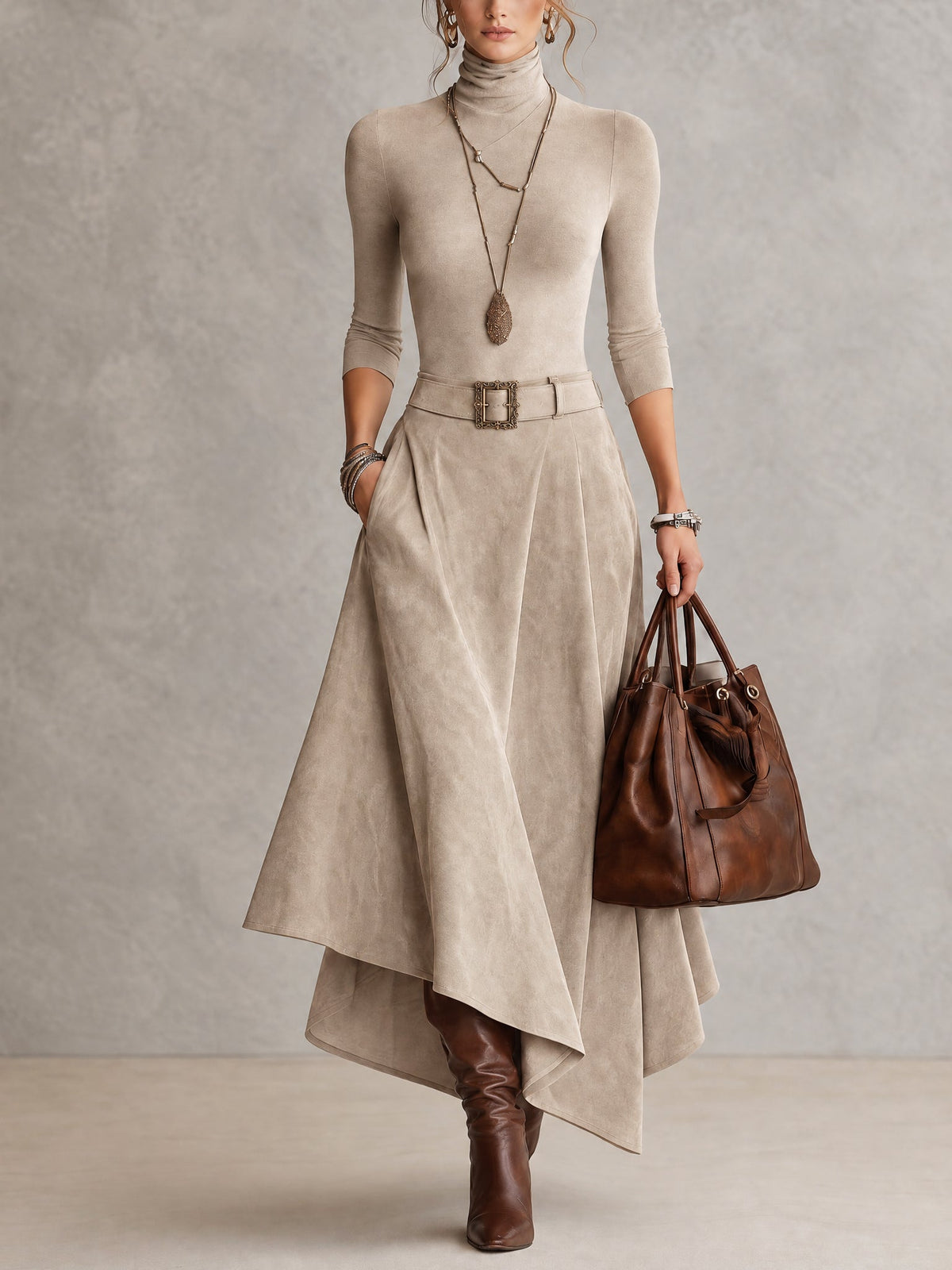 Amparo | Conjunto de color topo, de punto, con cuello alto y falda asimétrica con efecto ante