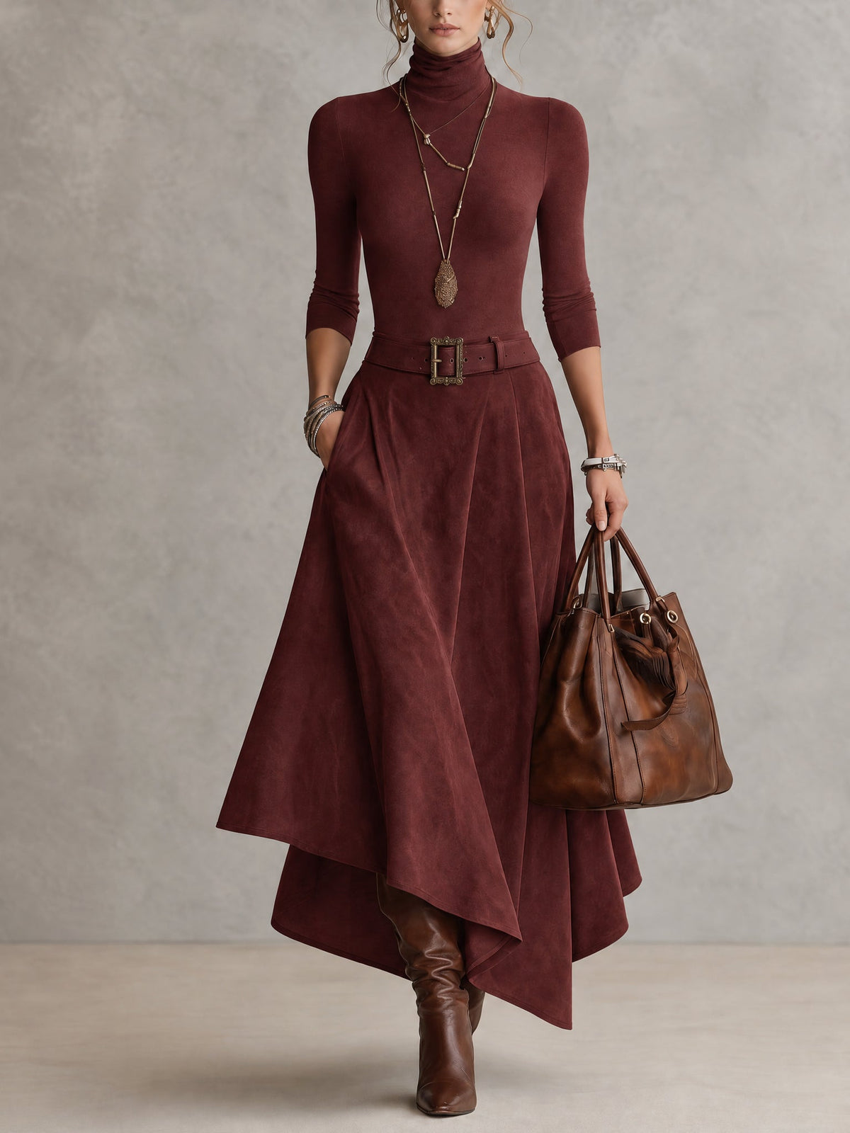Amparo | Conjunto de color topo, de punto, con cuello alto y falda asimétrica con efecto ante