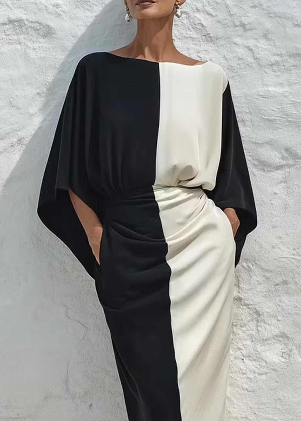Conjunto de dos piezas compuesto por un top y una falda midi en contraste de colores blanco y negro