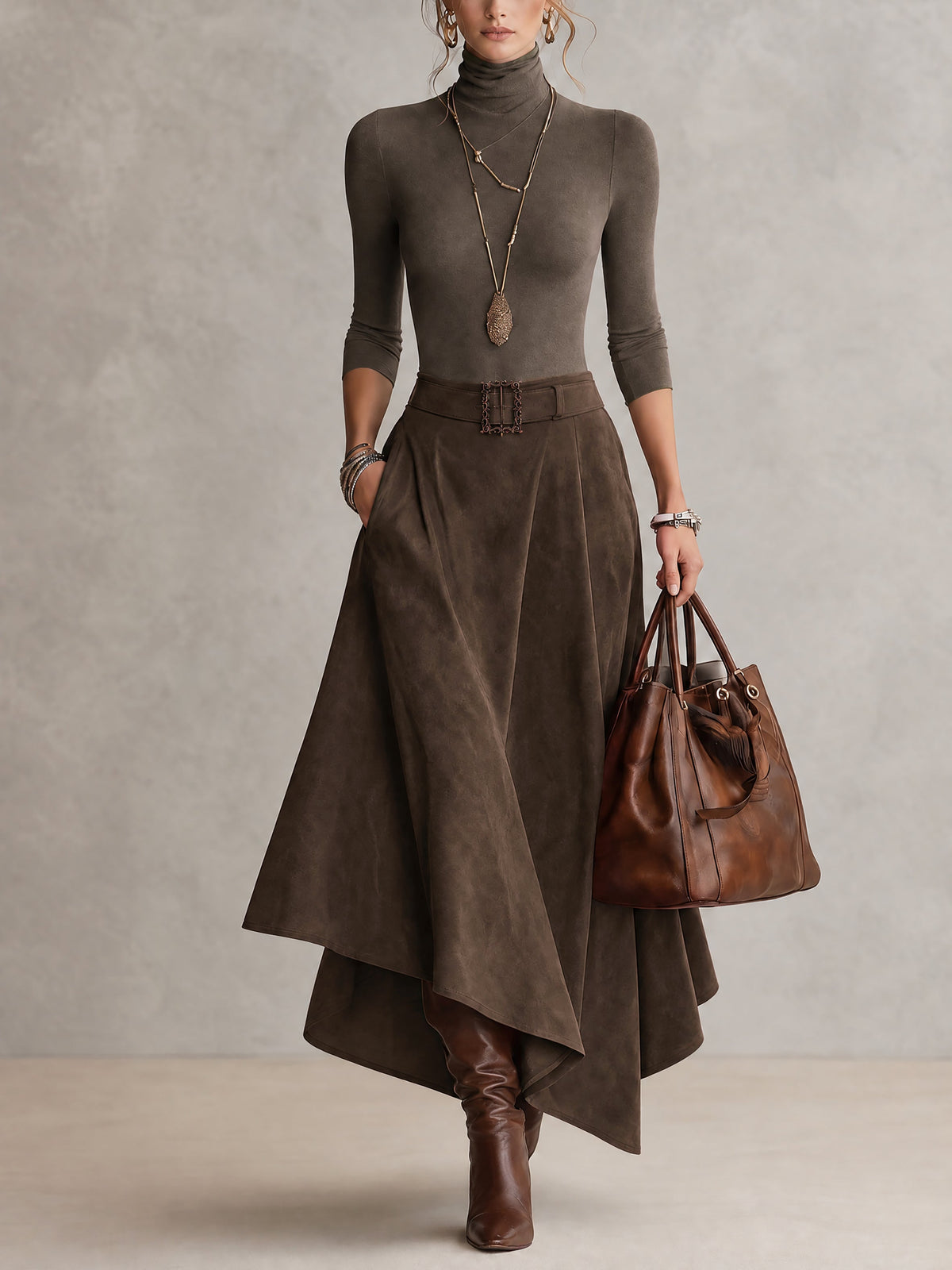 Amparo | Conjunto de color topo, de punto, con cuello alto y falda asimétrica con efecto ante