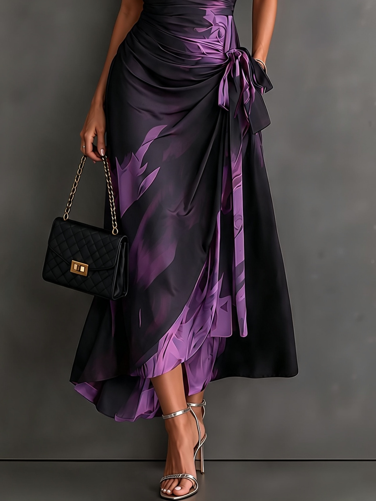 Vestido midi cruzado con estampado abstracto en rojo y negro, cuello en V, manga corta, cintura para atar y bajo asimétrico con volantes