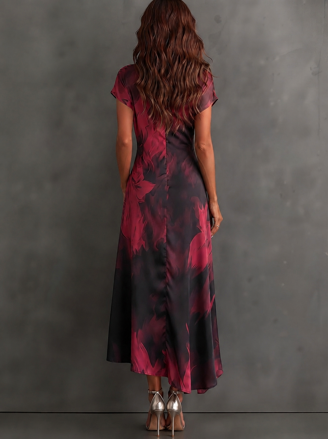 Vestido midi cruzado con estampado abstracto en rojo y negro, cuello en V, manga corta, cintura para atar y bajo asimétrico con volantes