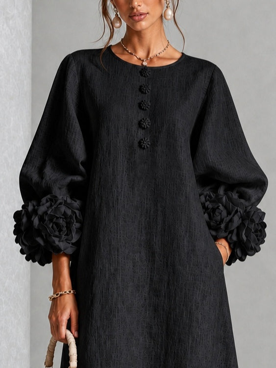Vestido midi negro con estampado floral, botones y mangas con motivos florales extravagantes
