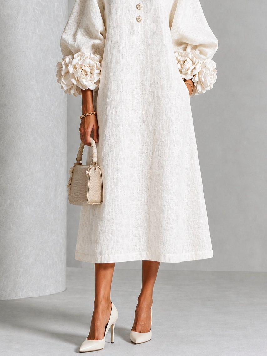 Vestido midi blanco con botones con motivos florales y mangas decoradas