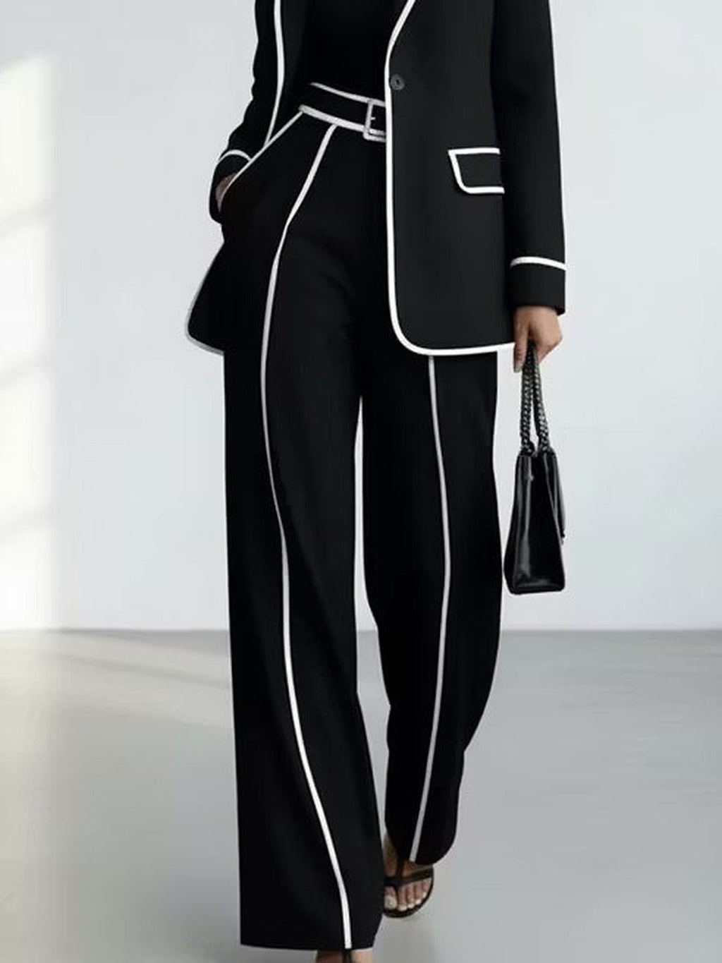 Manuela | Conjunto de chaqueta y pantalón con ribetes en contraste, negro