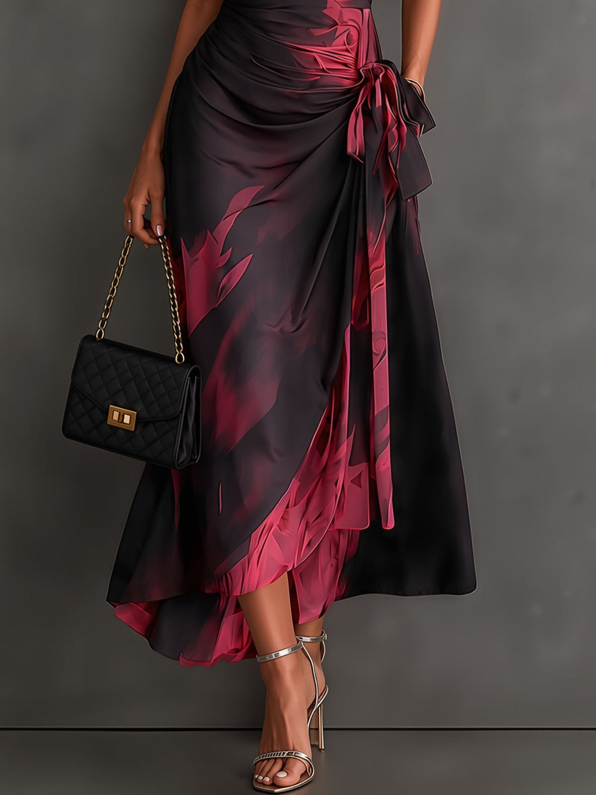 Vestido midi cruzado con estampado abstracto en rojo y negro, cuello en V, manga corta, cintura para atar y bajo asimétrico con volante